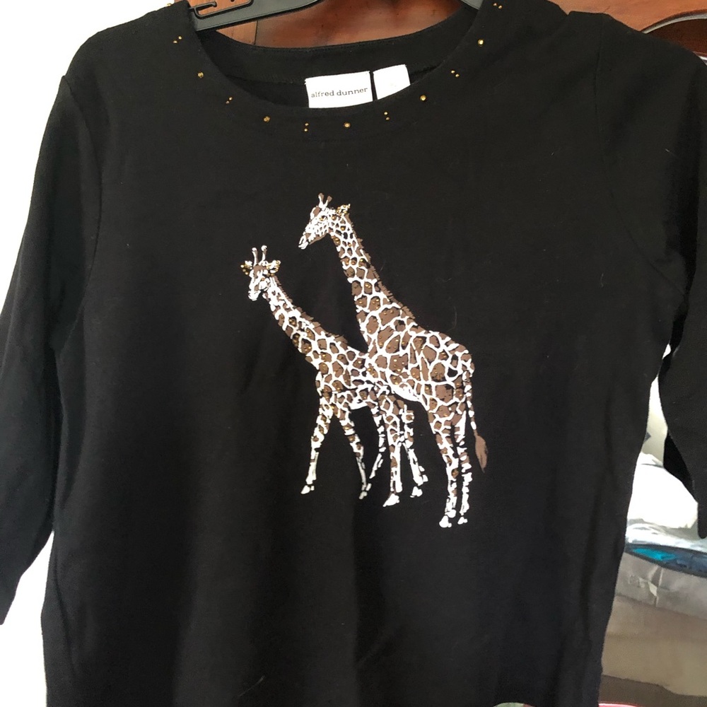 Black long sleeve sweater with Giraffes on the front